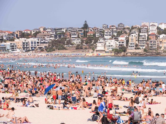 Thousands flock to Bondi Beach on Christmas Day in 2019. This year, the tourists will be largely absent. Picture: Daily Telegraph/Flavio Brancaleone