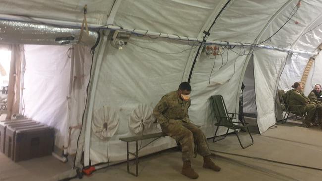 A soldier waits to see a doctor inside the Exercise Talisman Sabre field hospital. Picture: Jodie Munro O'Brien