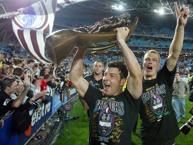 A fresh faced Lewis celebrates his first grand final win with the Penrith Panthers in 2003. Picture: Gregg Porteous. Rugby League