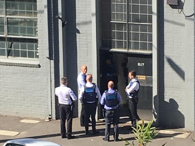 Police during a raid on Thompson’s Port Melbourne property.