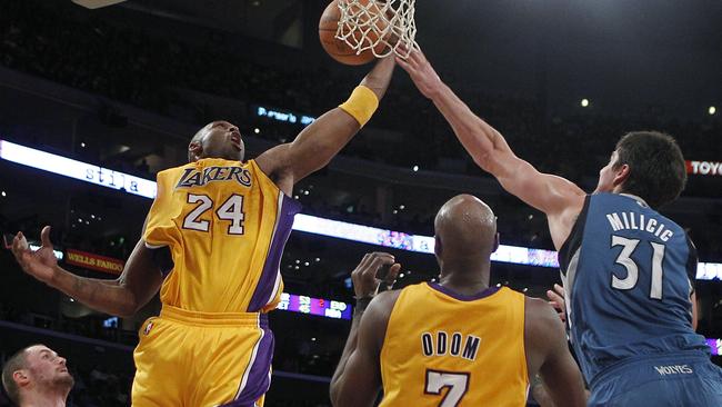 Los Angeles Lakers guard Kobe Bryant, left, gets a rebound against Minnesota Timberwolves centre Darko Milicic in 2010. (AP Photo/Jae C. Hong)