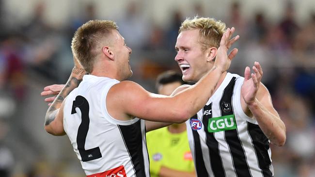 Jordan De Goey and Jaidyn Stephenson celebrate a goal during Collingwood’s dominant second half. Picture: AAP Image/Darren England.