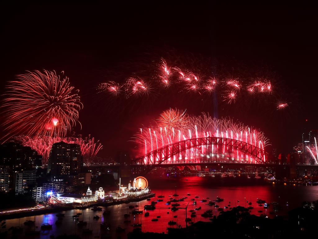 Fireworks light up the sky above Sydney Harbour during the midnight fireworks display during New Year's Eve celebrations on January 1st, 2020 in Sydney, Australia. (Photo by Cameron Spencer/Getty Images)