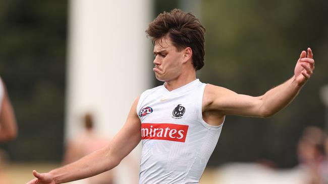 MELBOURNE, AUSTRALIA - APRIL 03: Josh Carmichael of the Magpies kicks the ball during a Collingwood Magpies AFL training session at Olympic Park Oval on April 03, 2024 in Melbourne, Australia. (Photo by Robert Cianflone/Getty Images)