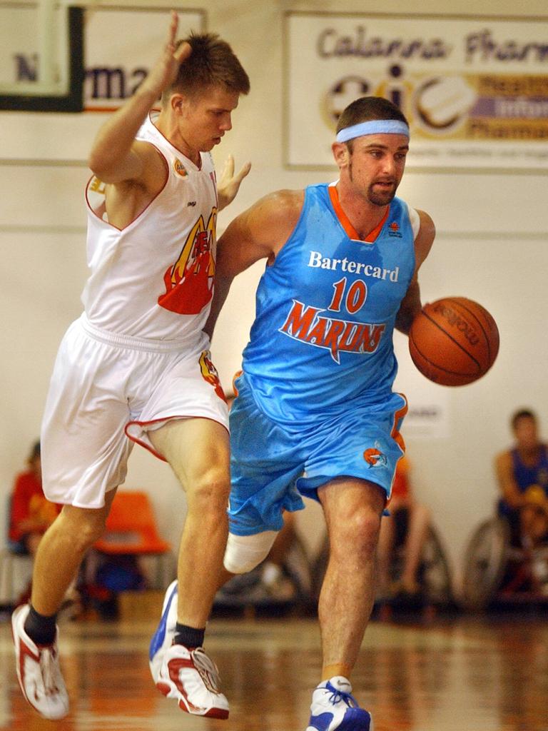 Cairns' Ben Arkell (right) fends off Towsville's Tim Duroux in the North Queensland Games basketball final. Picture: Pasco Rogato