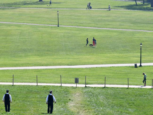 Police officers patrol Primrose Hill as warm weather tests the nationwide lockdown. Picture: AFP