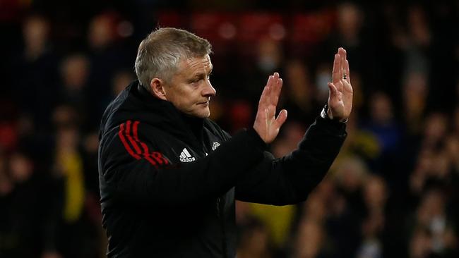 Manchester United's manager Ole Gunnar Solskjaer apologises to fans after a woeful loss to Watford. (Photo by Ian KINGTON / AFP)