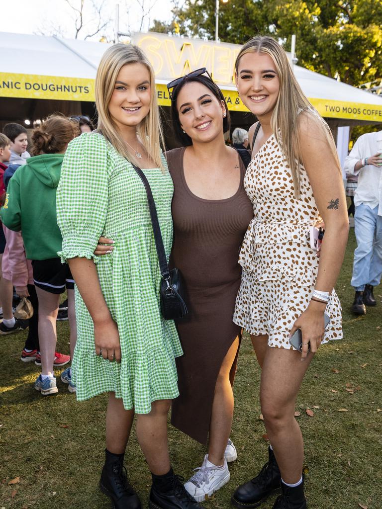 At the Festival of Food and Wine are (from left) Emma Frasle, Alex Ivory and Kristy Errington, Carnival of Flowers 2022, Saturday, September 10, 2022. Picture: Kevin Farmer