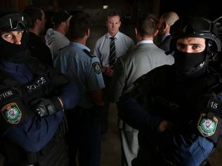 Detective Chief Inspector David Adney (centre, wearing a tie) is the commander of Strike Force Raptor and has been since its inception in 2009. Picture: Sam Ruttyn