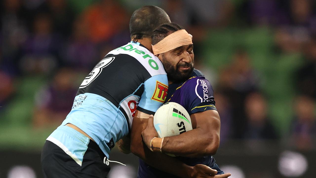 Justin Olam is tackled by Will Chambers. (Photo by Robert Cianflone/Getty Images)