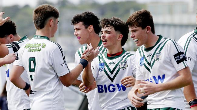 Rams players congratulate Riley Carter (centre) on his try. Picture: John Appleyard