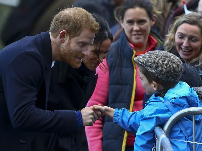 Prince Harry and his fiancée US actress Meghan Markle greet well-wishers on their arrival to Cardiff Castle in Cardiff, south Wales on January 18, 2018, for a day showcasing the rich culture and heritage of Wales. .Picture: AFP