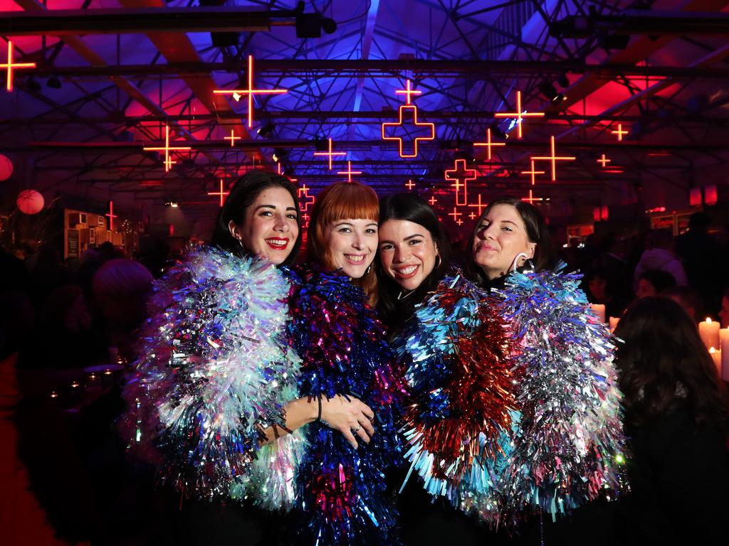 Chrisanthi Demos, left, Rachel Burke, Alexandra Atanasov, Siobhan Kranz, all from Brisbane, in jackets designed especially for Dark Mofo by Rachel. Dark Mofo in the city. Picture: NIKKI DAVIS-JONES