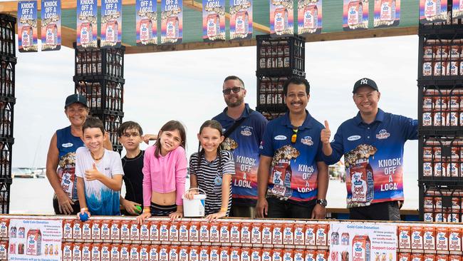 Sue Hewlett, Daniel Fuller, Anthony Thuraiveerasingam, Reagan Ampeloquio (Paul Icecoffee Boat), kids from left James Huffman, Jaxon Lee, Gabby Lee and Leila Huffan at the Darwin Beer Can Regatta at Mindil Beach, 2023. Picture: Pema Tamang Pakhrin