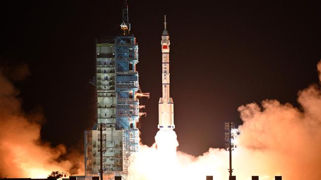 A long March-2F carrier rocket carrying the Shenzhou-19 spacecraft and crew of three astronauts lifts off from the Jiuquan Satellite Launch Centre in the Gobi desert. Picture: AFP.