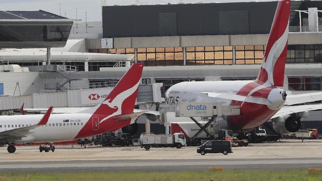 SYDNEY, AUSTRALIA - MARCH 10: Qantas Airways planes are seen at Sydney Airport on March 10, 2020 in Sydney, Australia. Qantas has cut almost a quarter of its international capacity for the next six months as travel demands fall due to fears over COVID-19. The airline today announced it was altering routes to London and would be parking eight of their 12 A380 aircraft. (Photo by Mark Evans/Getty Images)