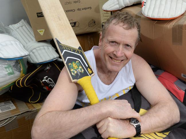 Local cricket author Ken Piesse with a pile of used equipment at Mount Eliza which will be shipped to Vanuatu this week. Picture:AAP/Chris Eastman