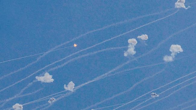 Rockets fired from southern Lebanon are intercepted by Israel's Iron Dome air defence system over the Upper Galilee region. Picture: AFP.