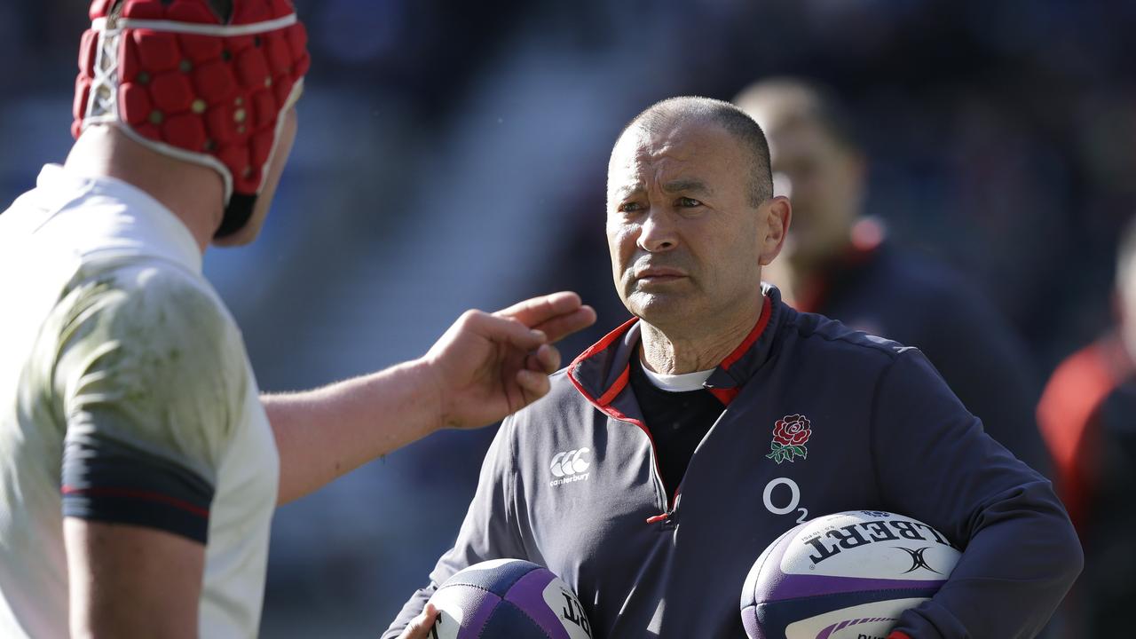 Eddie Jones talks to Dylan Hartley of England during training at Twickenham.