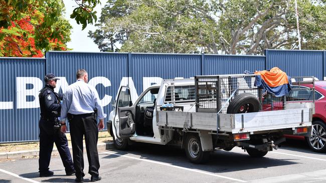 Police inspect the stolen car from Mackay left at WetSide Waterpark in Hervey Bay.