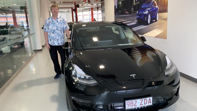 Griffith Business School professor David Butler with the Model 3 Tesla.