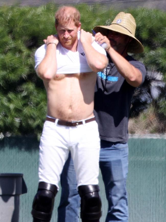 He had a friend on hand to help with his sunscreen. Picture: Backgrid