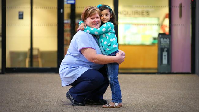 Isabelle hugs Hazel Headington who helped care for her when she was a newborn.