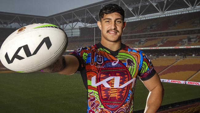 Kotomi Staggs unveils the Broncos Indigenous jersey for Round 12 that he helped design. Picture: Nigel Hallett.