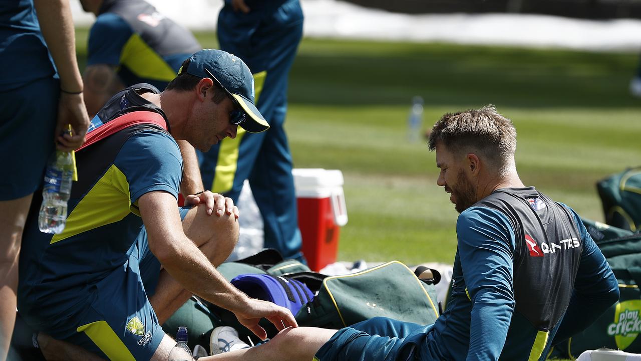 BIRMINGHAM, ENGLAND - JULY 29: David Warner of Australia is assessed by Australian Team Physiotherapist David Beakley after being struck on the leg during the Australia Nets Session at Edgbaston on July 29, 2019 in Birmingham, England. (Photo by Ryan Pierse/Getty Images)