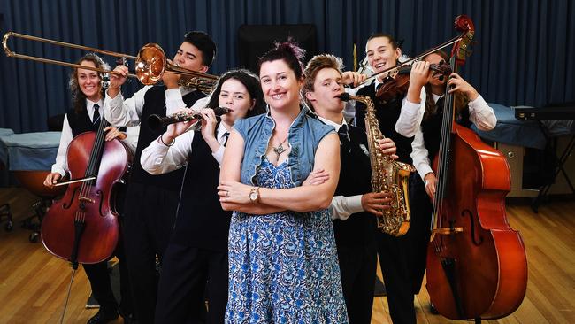 Marryatville music teacher Jasmin Feneley with music students Clara Gillan-Grant (cello), Alex Lee (trombone), Claire Challender (clarinet), Solomon Young (saxophone), Lizzie Zeuner (viola) and Kaynan Mallia (double bass). Picture: Mark Brake