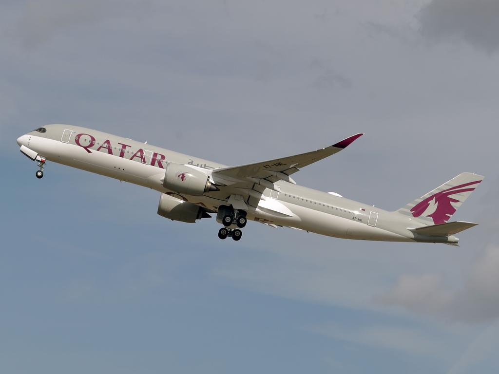 (FILES) This file photo taken on September 27, 2019 shows a Qatar Airways Airbus A350 aircraft taking off from Toulouse-Blagnac airport, near Toulouse. - Revelations that passengers flying through Doha were forced to endure vaginal inspections have upended Qatar's efforts to boost its reputation before the Gulf state hosts World Cup 2022, experts say. Officers marched women off a Sydney-bound Qatar Airways flight earlier this month and forced them to undergo intimate examinations after a newborn baby was found abandoned in an airport bathroom. (Photo by PASCAL PAVANI / AFP)