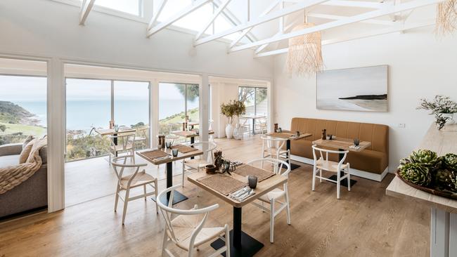 The cosy dining room with a spectacular view over Sea Dragon's private beach, Pink Bay. Picture: Supplied