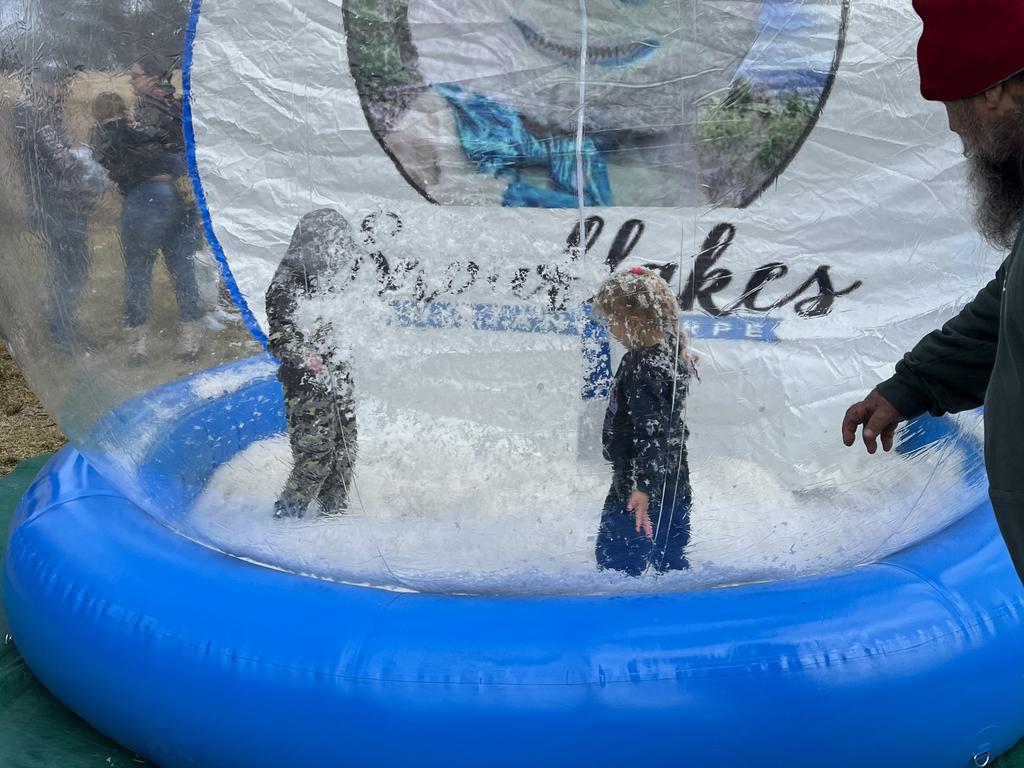 Obie (L) and Spencer (R) in the snowglobe at Snowflakes in Stanthorpe on Saturday, July 1 2023. ​