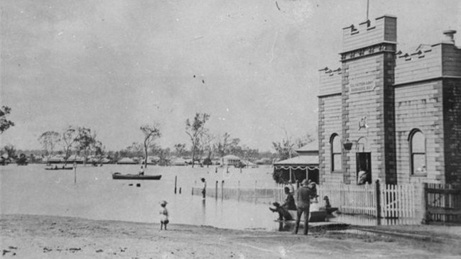 Tantitha Street Floods, 1890. Floodwaters submerge Tantitha Street in Bundaberg, showcasing the challenges of early settlement life. Source: State Library of Queensland