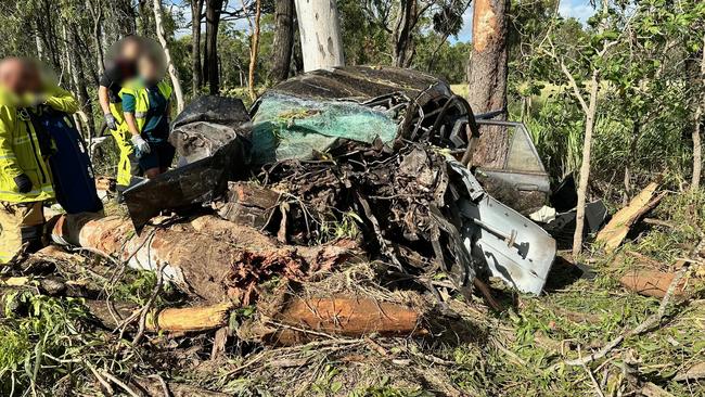 Emergency services at the scene of an accident at Greenlake Rd, Sandringham near Rockhampton where a young man's car rolled and collided with a tree on February 27, 2025, leaving him trapped and suffering life-threatening injuries.