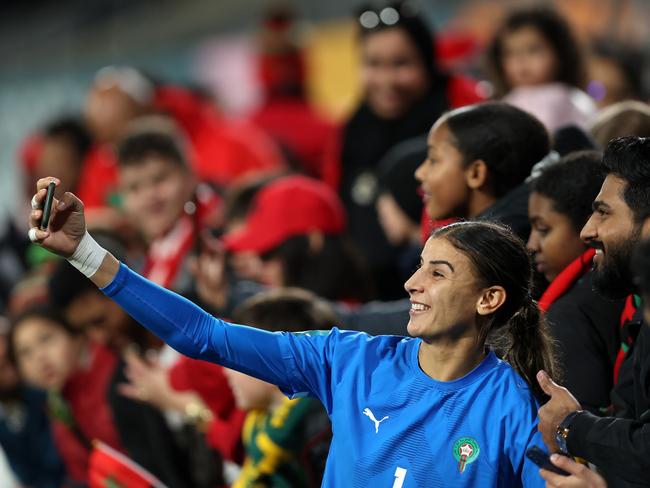 Morocco’s Khadija Er-Rmichi celebrates reaching the last 16 with fans. Picture: Paul Kane/Getty Images.