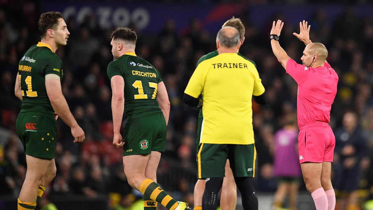 Australia's Angus Crichton (2L) is sent to the sin bin for 10 minutes during the Rugby League World Cup Men's final between Australia and Samoa at Old Trafford stadium, in Manchester, on November 19, 2022. (Photo by Oli SCARFF / AFP)