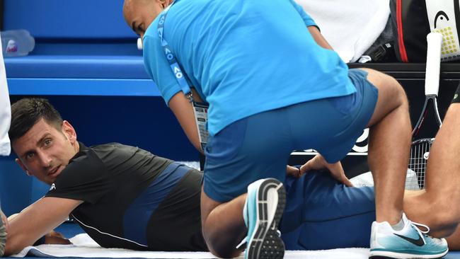 Novak Djokovic receives medical attention during his win over Albert Ramos-Vinolas. Photo: Peter Parks (AFP)