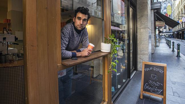 Sam Hall-Haydon at Tulip Coffee in a deserted Degraves Street, in Melbourne’s CBD. Picture: Aaron Francis