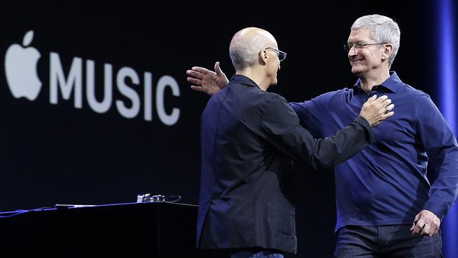 Launch day ... Apple CEO Tim Cook, right, hugs Beats by Dre co-founder and Apple employee Jimmy Iovine at the Apple Worldwide Developers Conference. Picture: AP