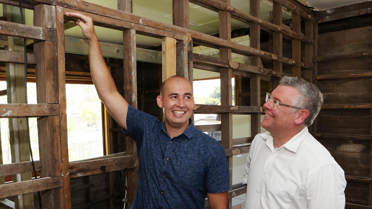 Federal Minister for Emergency Management Murray Watt with Luke Greaves at his flood-affected home in Rocklea. Picture: Liam Kidston