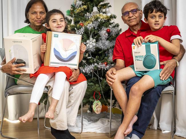 Smartdaily. Top Christmas gift ideas for grandparents. Nisha and Anant Nigam with their grandkids Natasha (5) and Nevan (8). Picture: Jake Nowakowski