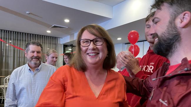 A jubilant Donna Davis enters Rosehill Bowling Club.