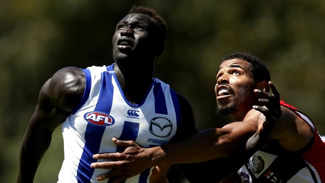 Kangaroos rookie Majak Daw battles St Kilda rookie Jason Holmes. Picture: Michael Klein