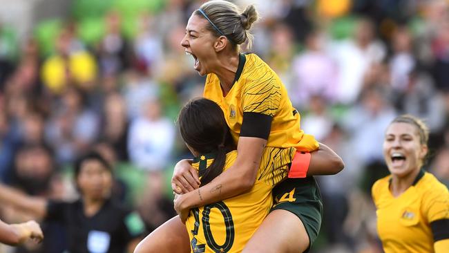 Australia's Alanna Kennedy leaps into the arms of teammate Sam Kerr after scoring against Argentina's during their Women's Cup of Nations match last year.