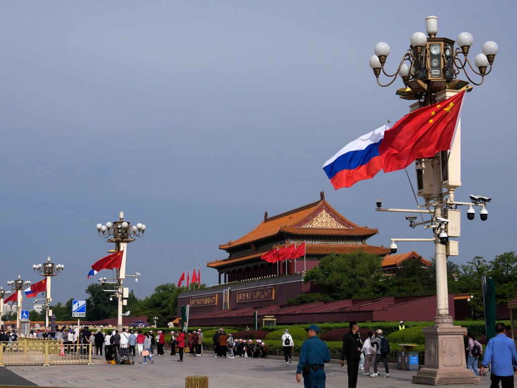 Russian and Chinese national flags flutter in the wind at Tiananmen Gate, Thursday, May 16, 2024, in Beijing. Russia's President Vladimir Putin arrived Thursday in Beijing for a two-day state visit to China, in a show of unity between the authoritarian allies as Moscow presses forward with a new offensive in Ukraine. (AP Photo/Andy Wong)