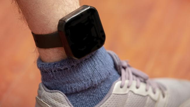 A GPS tracker such as those used on accused criminals released on home detention bail.