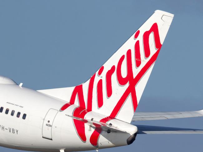 Sydney, Australia - October 7, 2013: Virgin Australia Airlines Boeing 737 airliner landing at Sydney Airport.