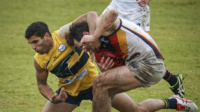 Eagles’ Jared Petrenko makes sure Matt Wright doesn’t get ahead at Woodville Oval on Sunday. Picture: Mike Burton/AAP