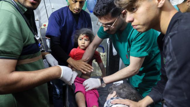 Children injured during Israeli bombardment receive treatment at at the Kuwait Hospital in Rafah, on the southern Gaza Strip on Saturday. Picture: AFP